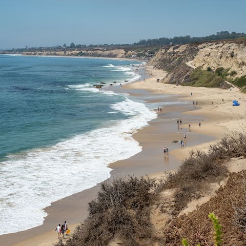 Look out over the crashing waves and golden sand at Newport Beach, twenty minutes from your front door
