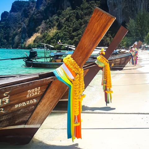Explore the nearby beach and take a ride in a long-tail boat – one of Thailand's characteristic modes of transport