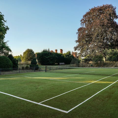 Challenge each other to a few sets of tennis on the private court