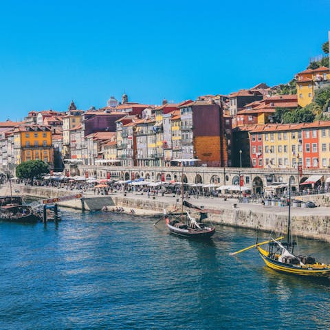 Explore Porto's bustling Cais da Ribeira district on the banks of the Douro River