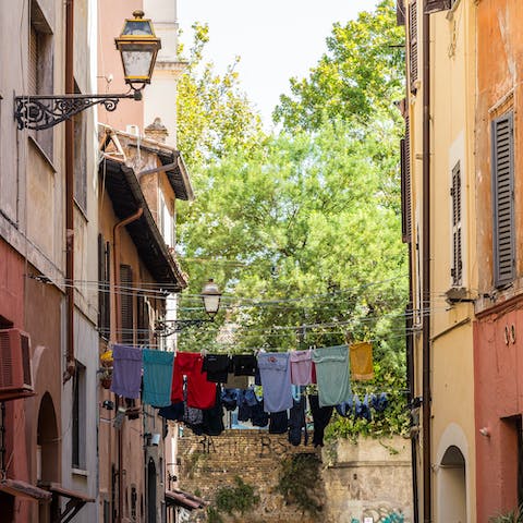 Explore your scenic Trastevere neighbourhood, known for its traditional trattorias, craft beer pubs and artisan shops