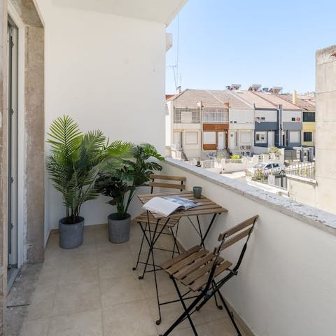 Sip a glass of Portuguese wine outside on the balcony