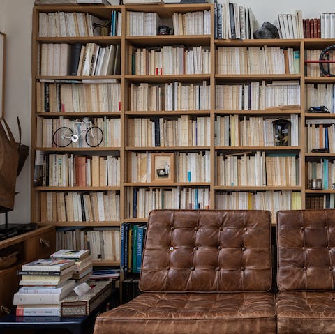 Get lost in the pages of a good book on the well-worn leather couch
