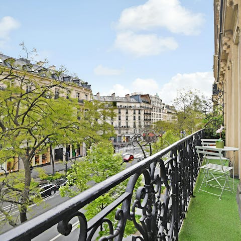 Take in the Parisian architecture from this home's private balcony