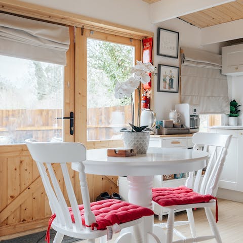 Rustle up a meal in the charming kitchen and share it around the table set for two