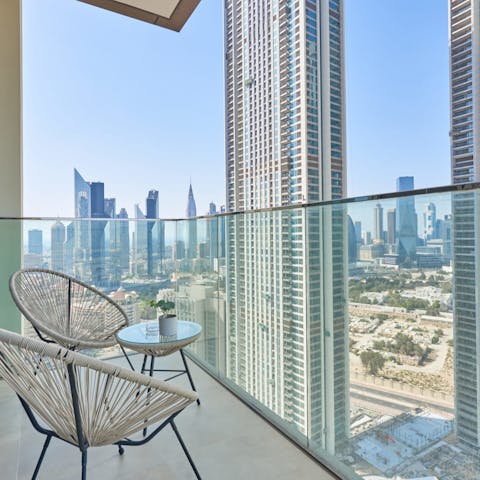 Enjoy gazing out at the views of the cityscape from the private balcony