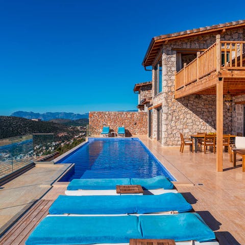 Practice your freestyle in the infinity pool's crystal waters