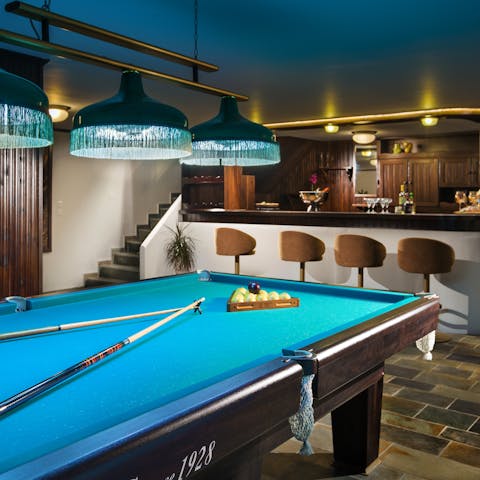 Play a game or two of pool, then grab a drink at the private bar