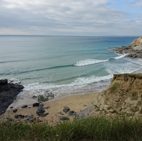 Take a twelve-minute stroll to the secluded sands of Duporth Beach