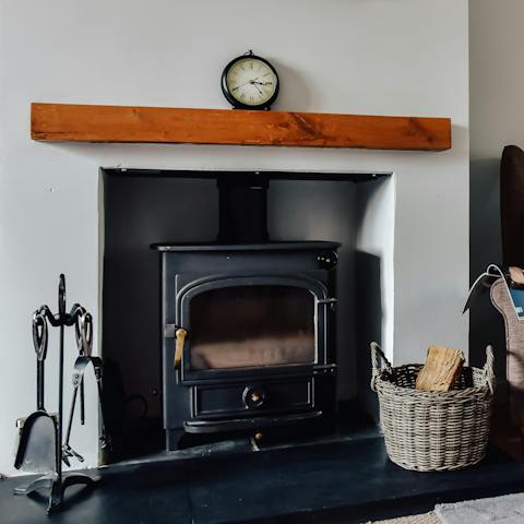 Cosy up next to the wood burning stove on chilly evenings