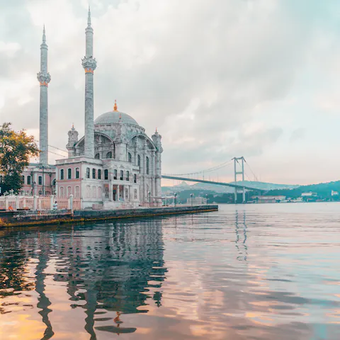 Explore the Bosphorus by boat and admire the Grand Mecidiye Mosque