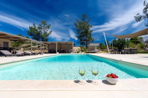 Dip your toes in this refreshing pool, as you sip Greek wine and watch a sunset overhead