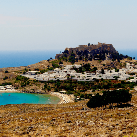 Explore the ancient fishing village of Lindos on the island of Rhodes in Greece