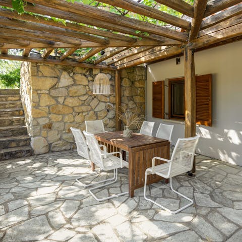 Gather your group and dine alfresco under the rustic exterior