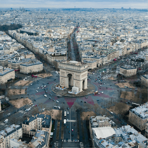 Soak up the vibrant heart of Paris from the Arc de Triomphe