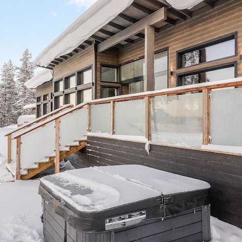 Sit out in the electric hot tub and admire the snow-covered scenery