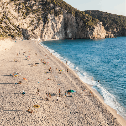 Swim in the clear blue water of Mikros Gialos – a twenty-minute drive away