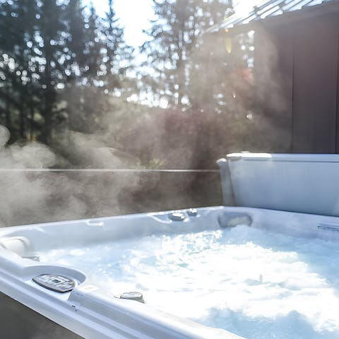Embrace the natural elements from the warmth of the hot tub