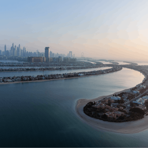 Stay in Dubai,  a fifteen-minute drive from the bustling Palm Jumeirah