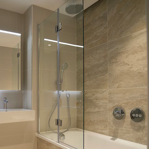 Start your mornings with a refreshing soak under the bathroom's rainfall shower