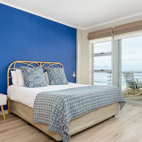 Wake up to sunshine and sea views in the coastal-inspired bedroom
