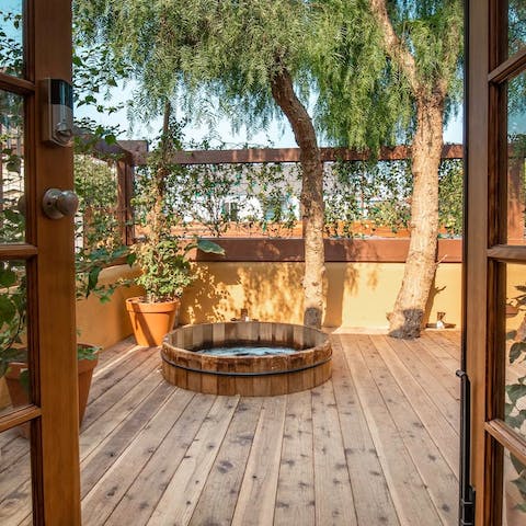 Step out onto the deck and straight into the cedar hot tub