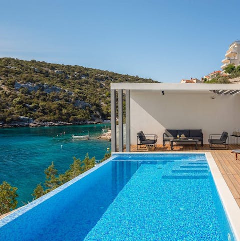 Plunge into the refreshing depths of the private pool