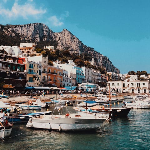Take a boat trip from the marina to admire Capri's coastline