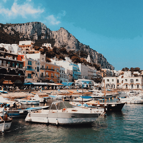 Take a boat trip from the marina to admire Capri's coastline