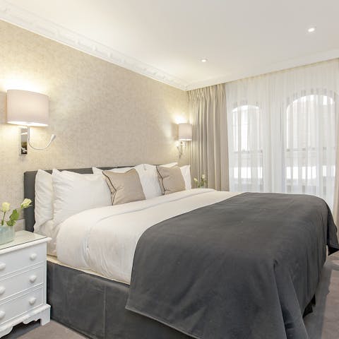 Doze off in the sumptuous bed after a day of exploring London