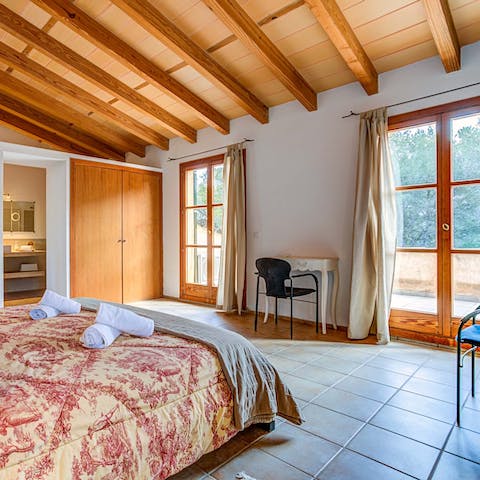 Step from the main bedroom onto the balcony for a morning coffee