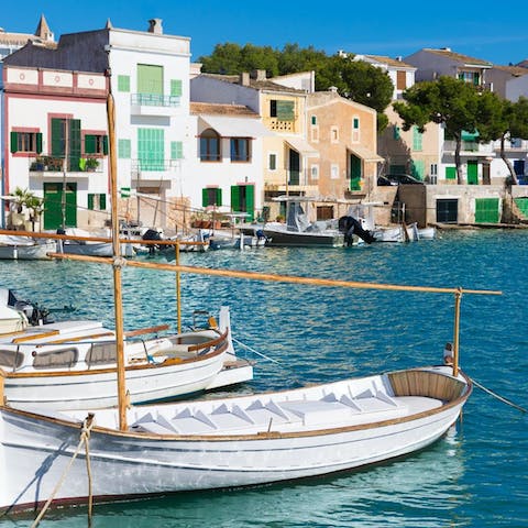 Visit charming Portocolom, a fifteen-minute drive away
