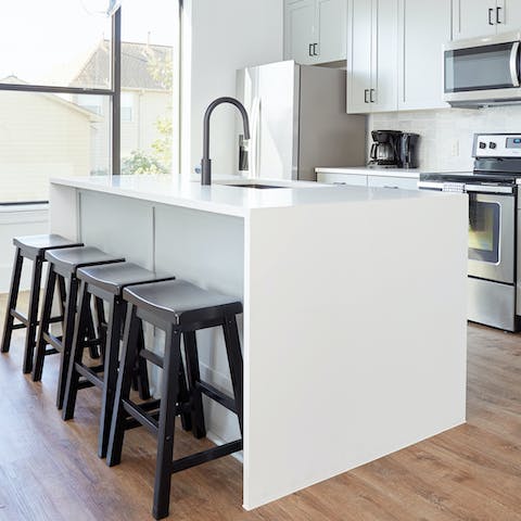 Gather round the kitchen island for an aperitif after a cultural day out in Houston