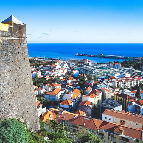 Explore the vibrant streets of Funchal, reached by car