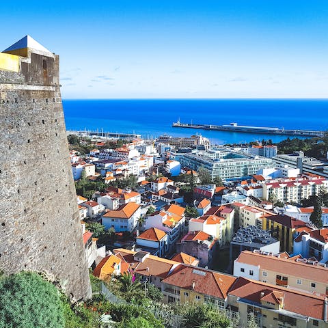 Explore the vibrant streets of Funchal, reached by car