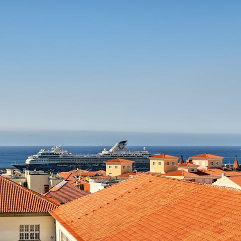 Watch cruise ships pass by from the private balcony