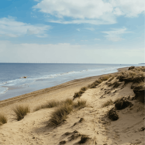 Sunbathe on Norfolk's coast, such as Cromer Beach, just over seven miles away