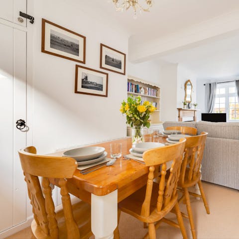 Gather round the rustic, wooden dining table for a Sunday roast