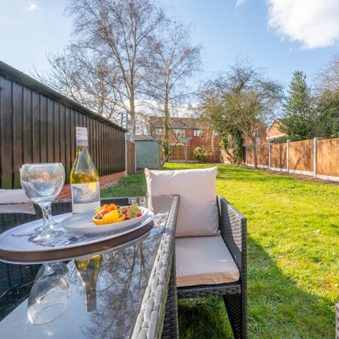 Pour youself a glass of pinot grigio in the private garden on a sunny afternoon