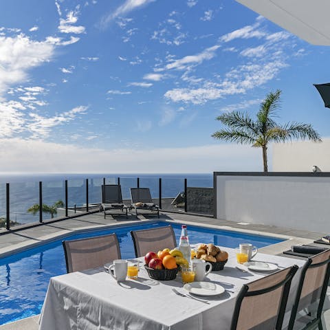 Dine alfresco by the pool and admire stunning sea views