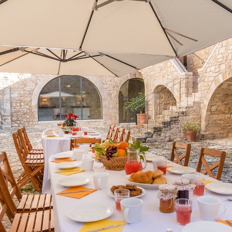 Dine alfresco in the cobbled courtyard