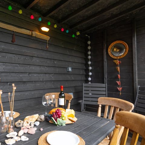 Get together for drinks and nibbles in the outside barn space