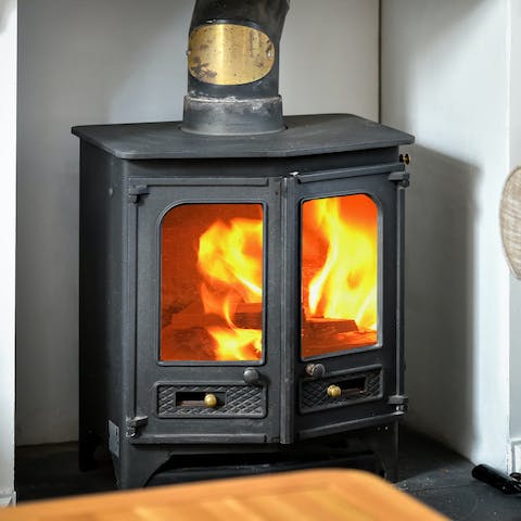 Get warm and toasty around your traditional log burner fireplace