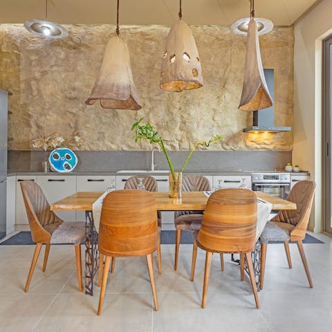 Set the table for a group feast in the stylish dining space
