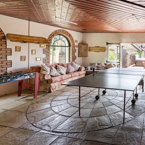 Challenge each other to ping pong and table football in the private games room