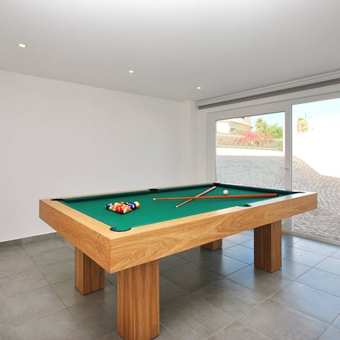 Gather for games of pool and foosball in the breezy games room