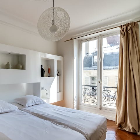 Open up the French doors and admire typical Parisian views