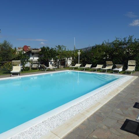 Spend sunny days on a lounger by the shared swimming pool