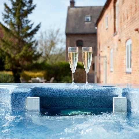 Clink glasses in the bubbling hot tub after a day on the walking trails