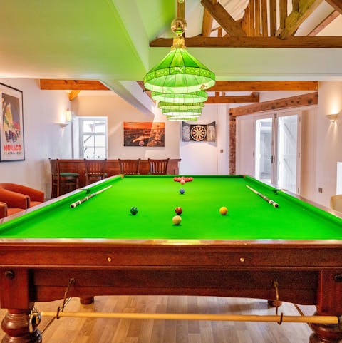 Have a pool, darts or table football match in the games room